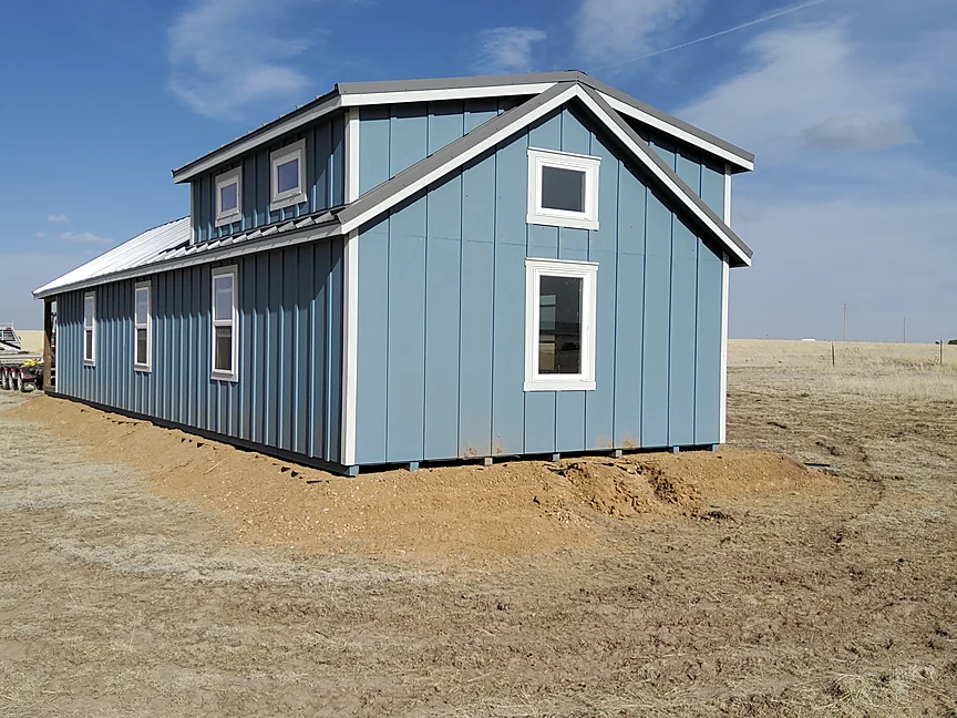 Blue Cabin Home Shell delivered on a Colorado lot
