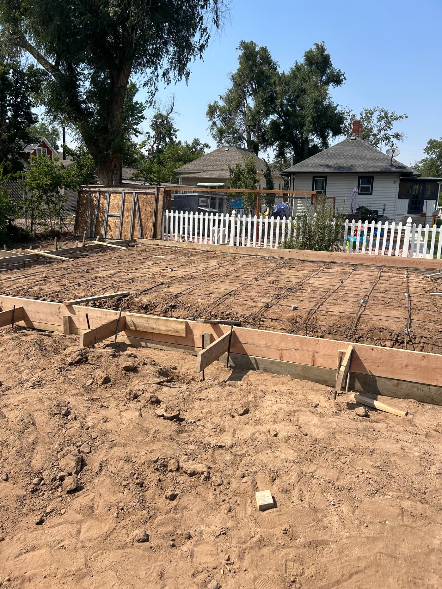 Wooden forms and reinforcement prepared on the Greeley property before the detached garage foundation was poured