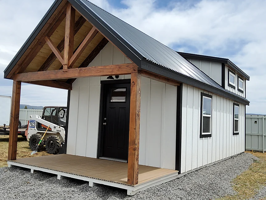White Cabin shell with timber frame front porch