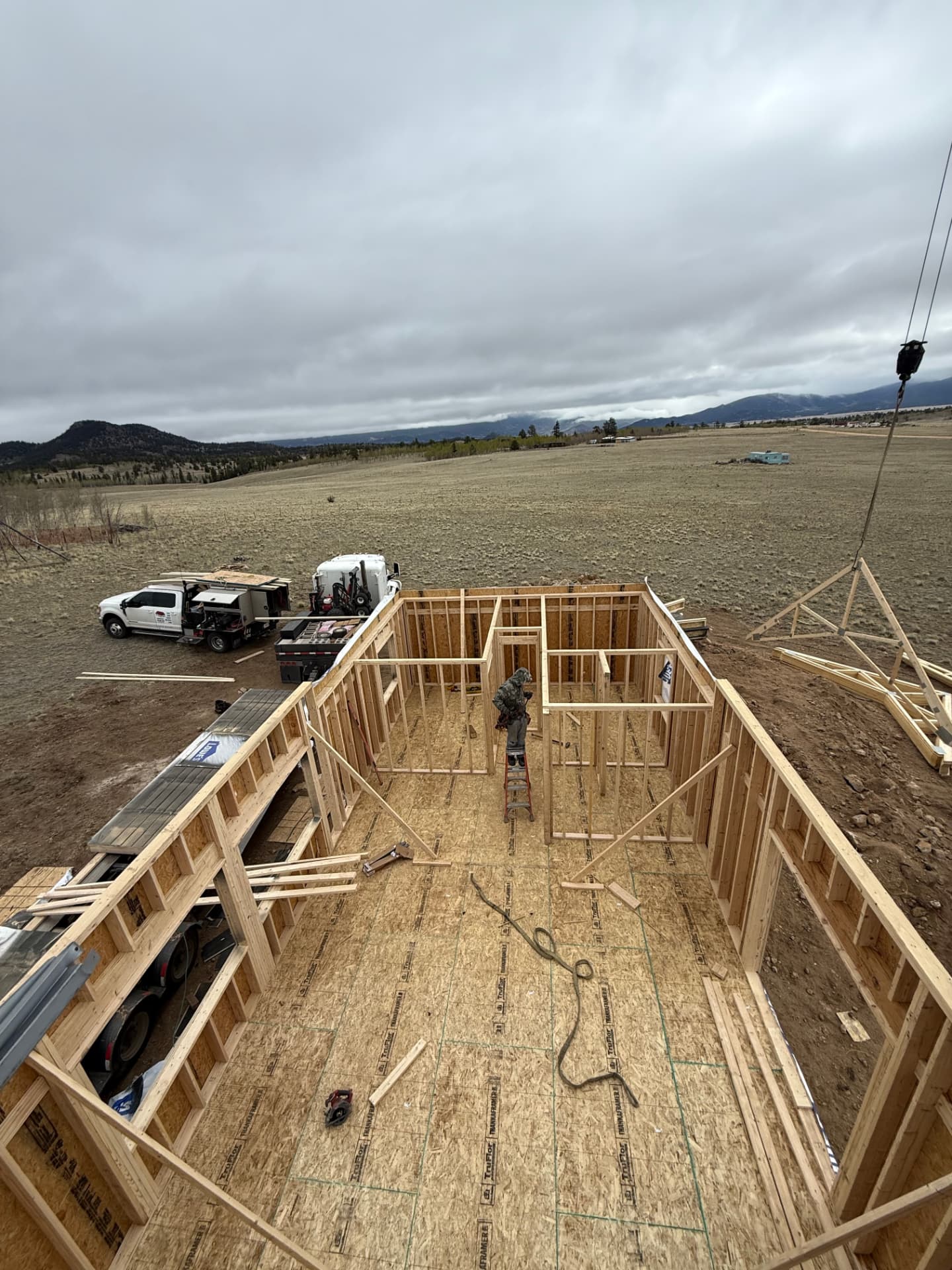Interior framing of a 20x44 home shell in Park County Colorado showing interior partition walls and sheathed subfloor