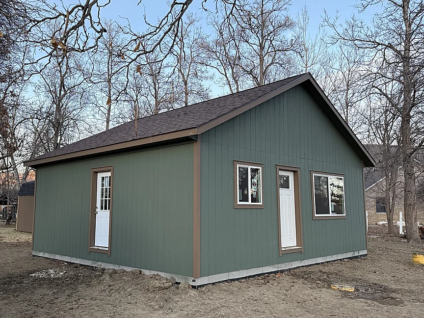 Green Sunny Side home shell delivered in the pines