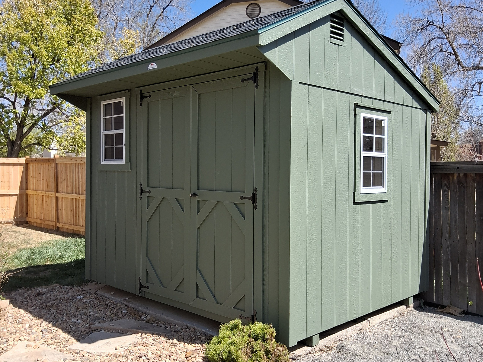Premium Quaker shed built in Colorado with offset roofline and covered entry