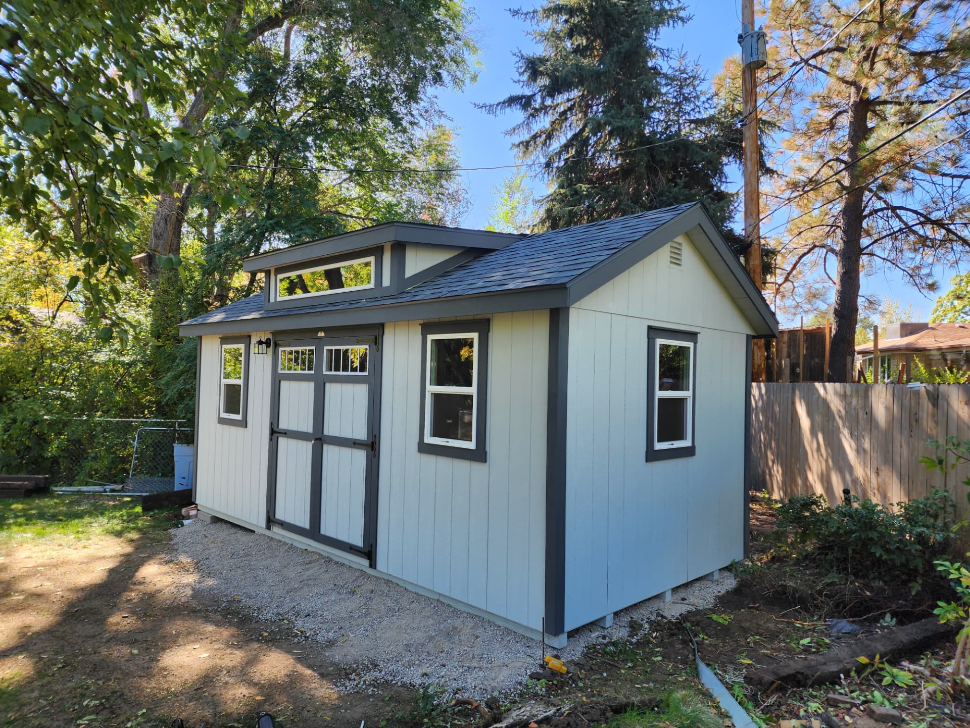 Classic A-Frame storage shed in a Colorado backyard sized for lawn equipment and tool storage