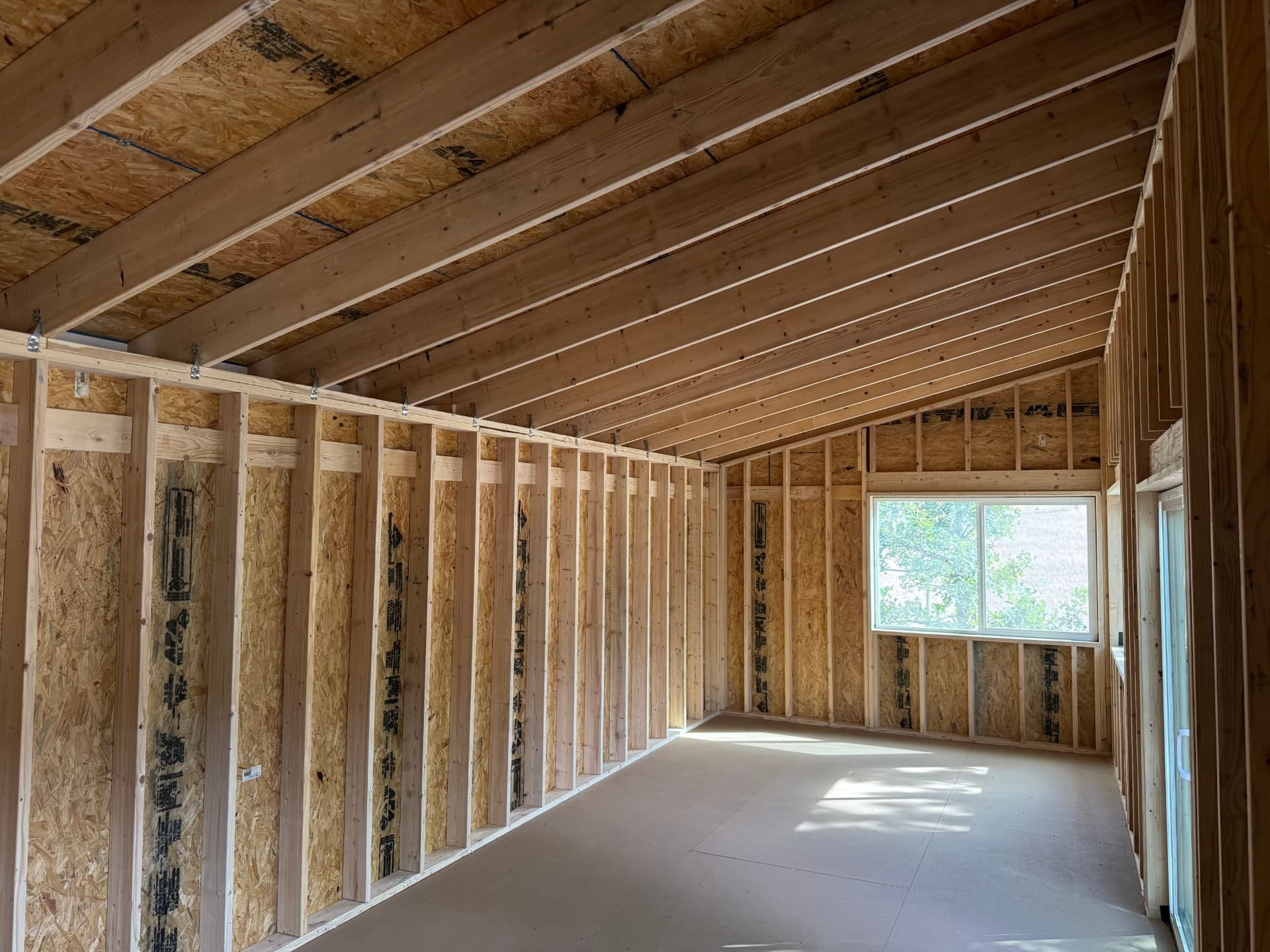 Open interior shell of a Studio Shed in Boulder Colorado ready for insulation, drywall and electrical