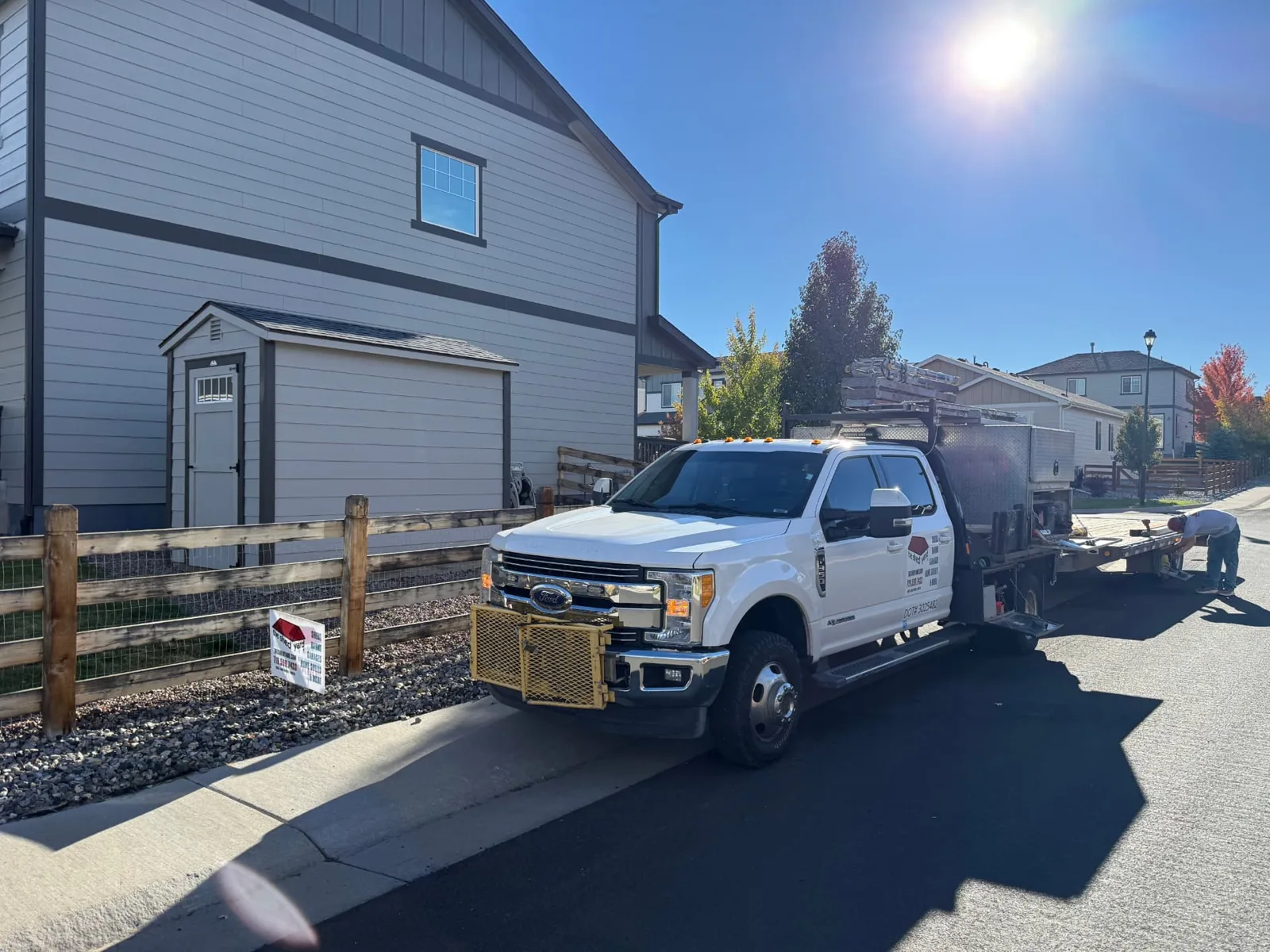 The Shed Yard truck and trailer parked on the street beside the completed shed