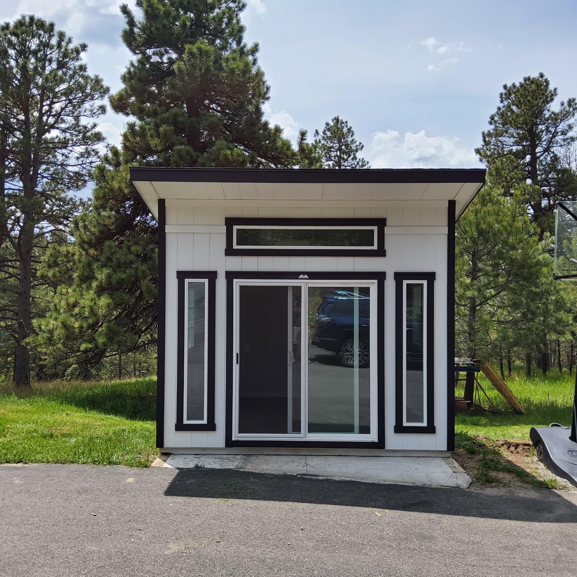 Single-slope studio shed with windows in a Colorado backyard