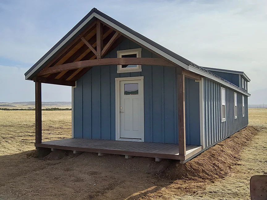 Blue Cabin shell with timber frame covered porch