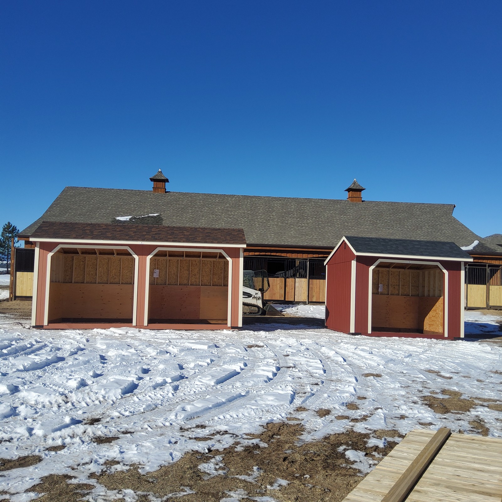 Loafing shed run-in horse shelter delivered to an open Colorado pasture