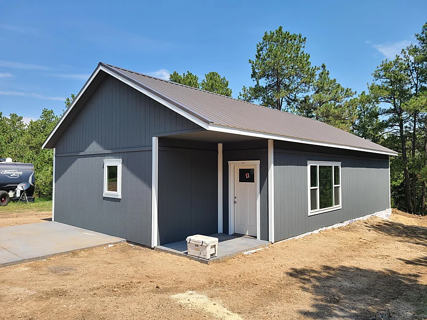 Gray Cabin Home Shell with covered side entry