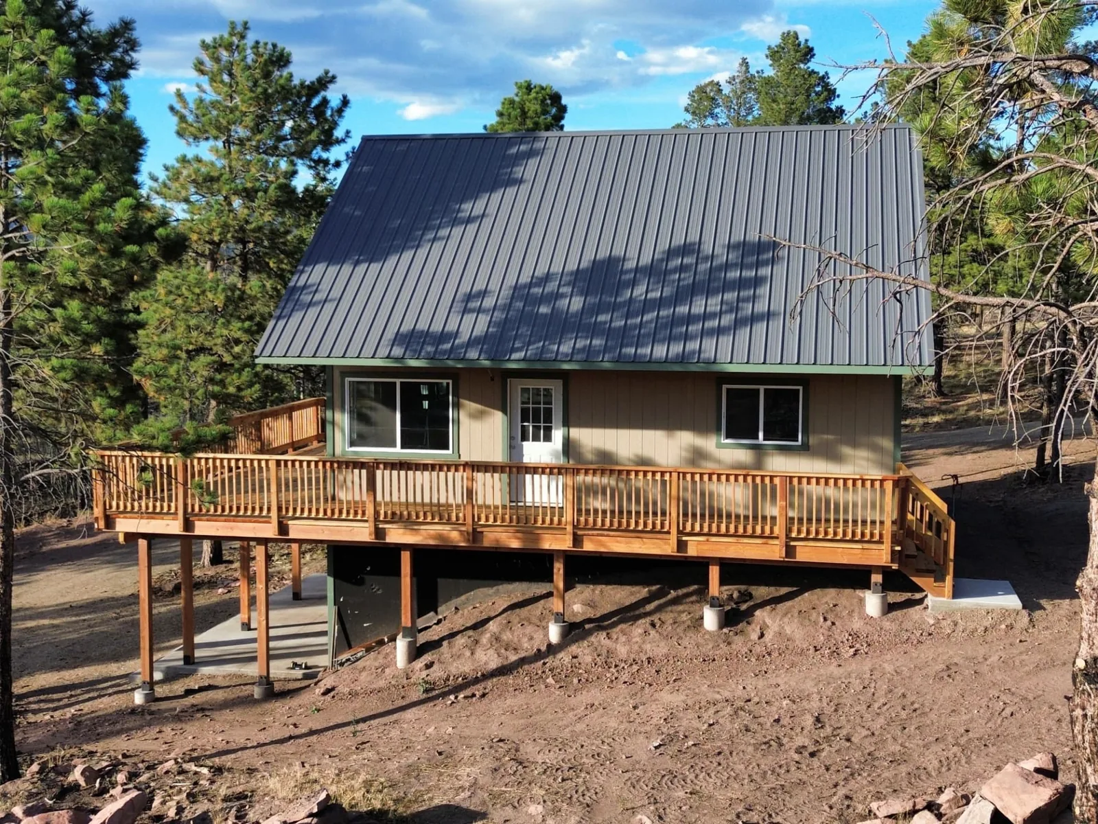 Completed 24x30 Sunnyside homeshell with deck in Fort Garland, Colorado