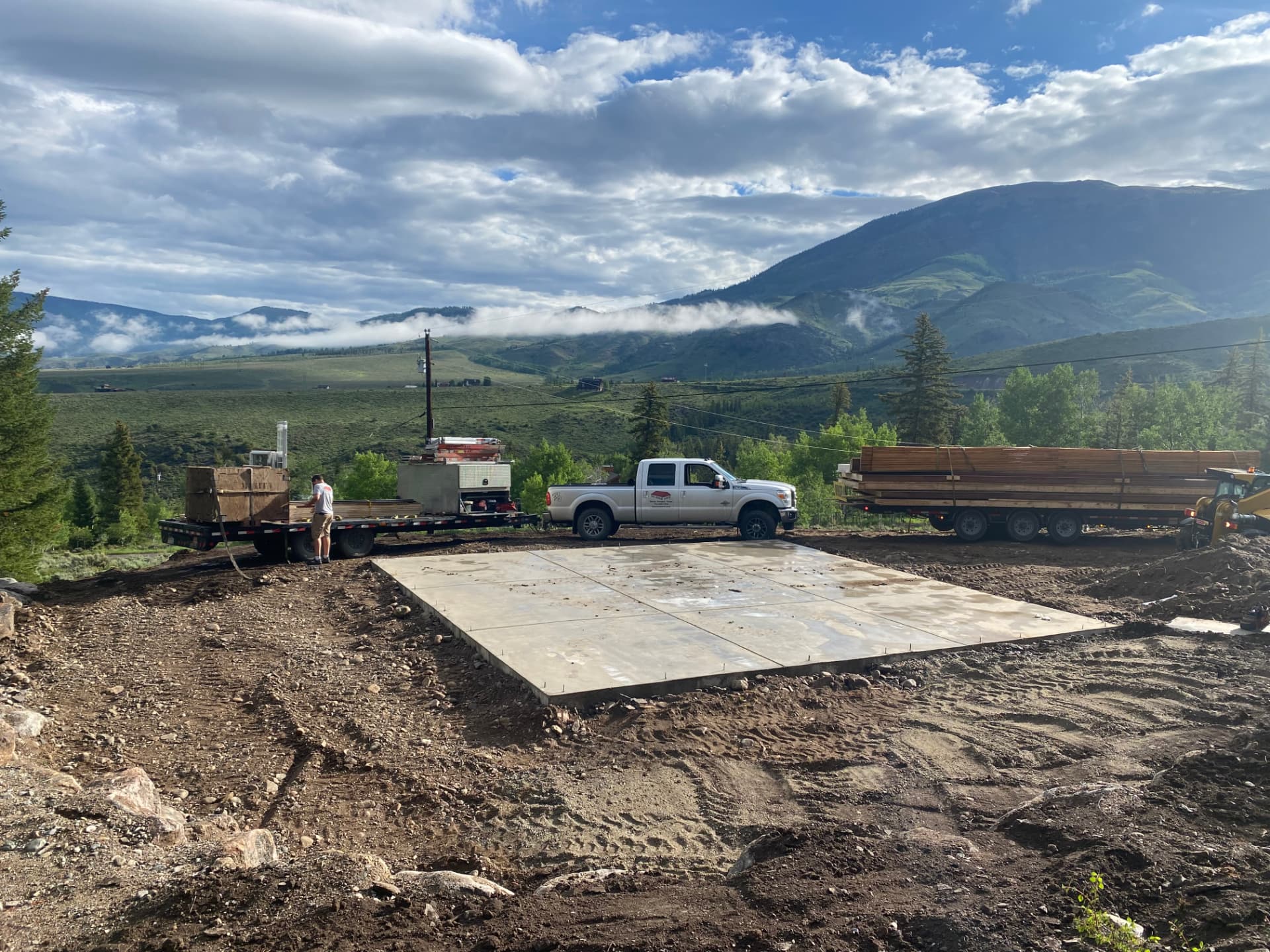 Poured concrete foundation and site prep for a detached garage build in Colorado